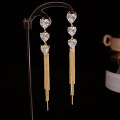 BÔNG TAI TÒN TENG 3 TIM ĐÁ PHỐI TUA RUA DÁNG DÀI