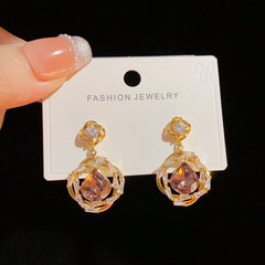 BÔNG TAI TÒN TENG ĐÁ TÍM GIỌT NƯỚC PHỚI VIỀN ĐÁ TRẮNG SANG TRỌNG