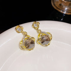 Bông Tai Tòn Teng Đá Ẩn Viền Xoắn Đá Trắng Thời Trang