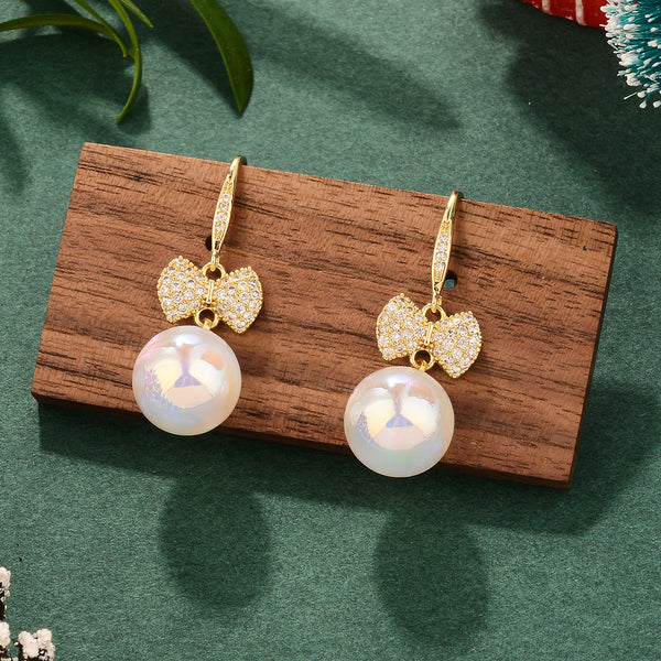 BÔNG TAI TÒN TENG HÌNH NƠ ĐÍNH ĐÁ TRẮNG PHỐI HẠT TRAI DẠNG MÓC