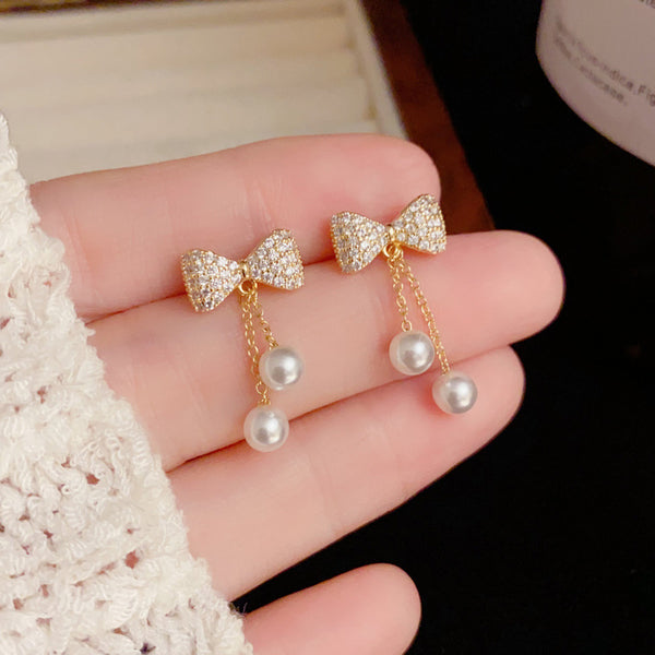 BÔNG TAI TÒN TENG NƠ ĐÍNH ĐÁ TRẮNG PHỐI 2 SỢI NỮ TÍNH