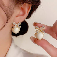 Bông Tai Hình Thoi Trắng Phối Nơ Đính Đá Nữ Tính