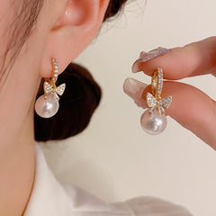Bông Tai Khoen Nơ Đá Trắng Phối Hạt Trai Nhỏ Xinh