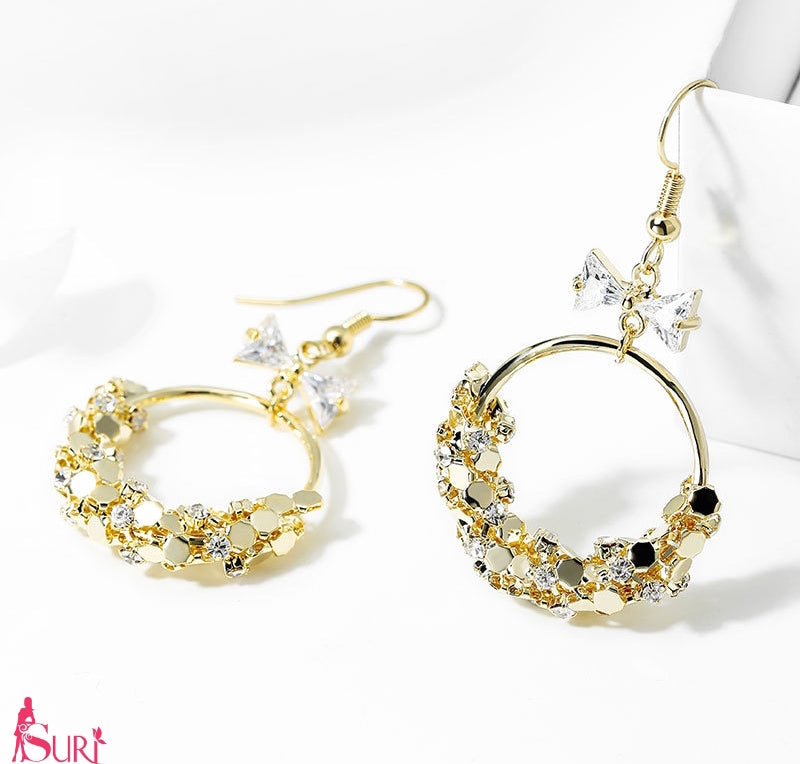 Bông tai khoen vàng đính nơ