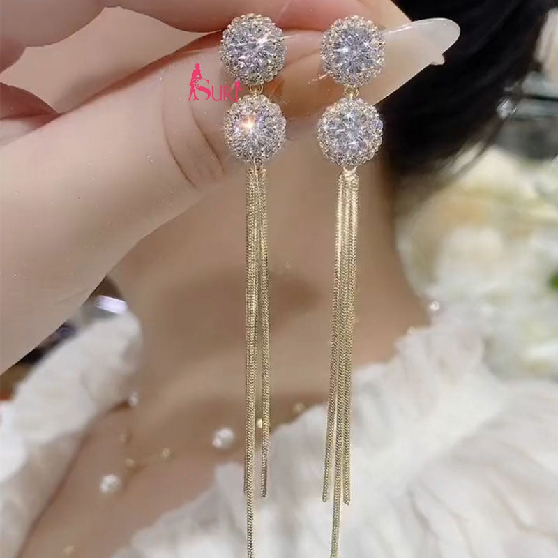 Bông Tai Tòn Teng 2 Hạt Đá Trắng Phối Tua Rua Vàng