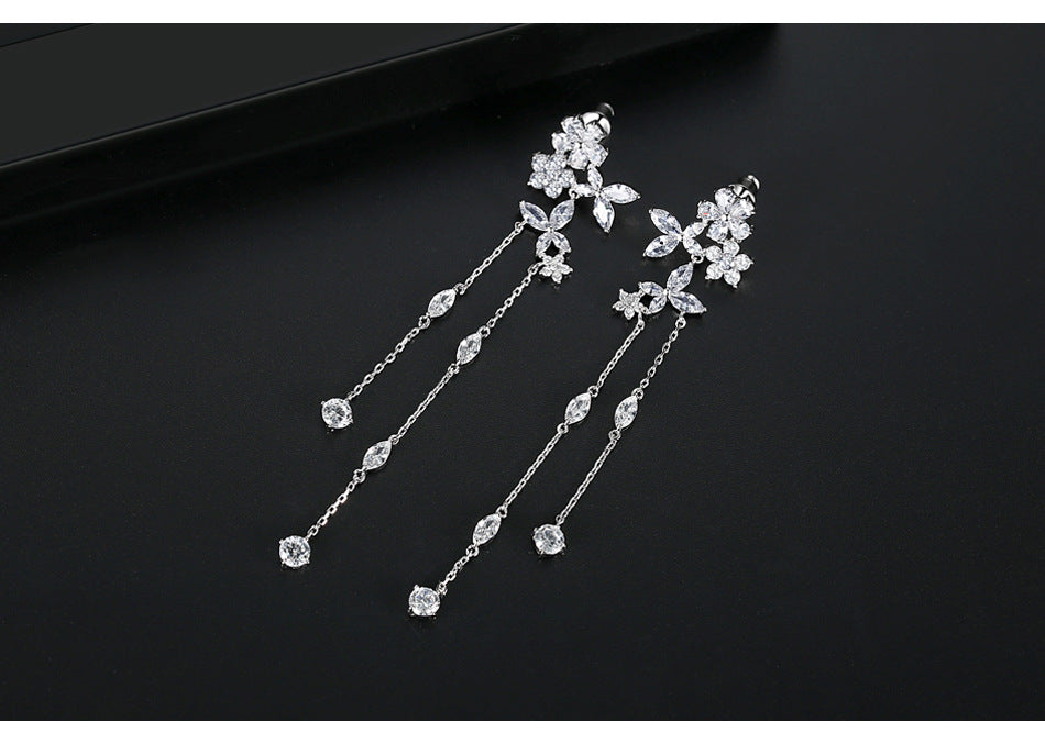 Bông Tai Tòn Teng Tua Rua Hoa Đá Trắng