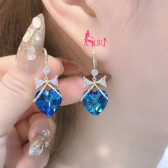 Bông Tai Tòn Teng Nơ Đá Trái Tim Xanh Dạng Móc