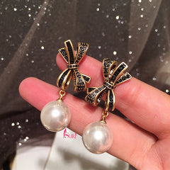 Bông Tai Tòn Teng Nơ Đính Đá Đen Ngọc Trai Trắng