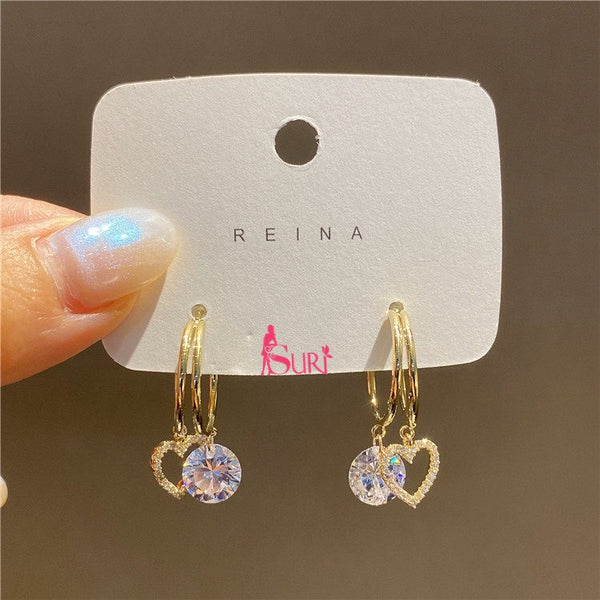 Bông Tai Tòn Teng Khoen Trái Tim Vàng Phối Đá Tròn Trắng Nữ Tính