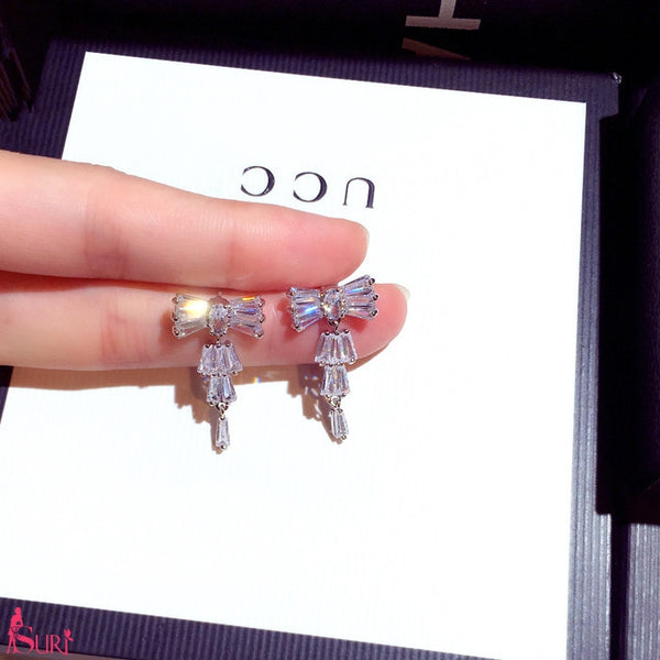 Bông Tai Tòn Teng Nơ Đá Trắng Dáng Dài