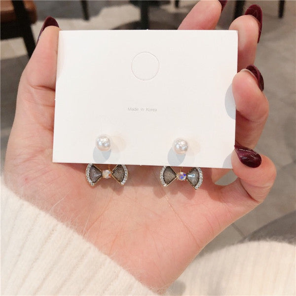 Bông Tai Nơ Đá Xám Viền Đá Đính Ngọc Trai