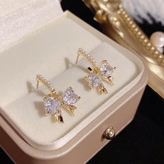 Bông Tai Nơ Đá SR135 Phối 1 Hàng Ngọc Trai Sát Tai