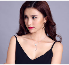 Bông tai tòn teng tam giác châu