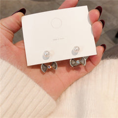 Bông Tai Nơ Đá Xám Viền Đá Đính Ngọc Trai