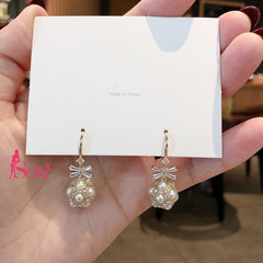 Bông Tai Tòn Teng Nơ Đá Quả Cầu Ngọc Trai Dạng Móc