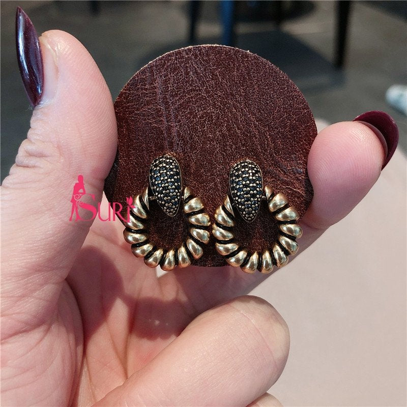 Bông Tai Tòn Teng Khoen Đá Đen Xoắn Ốc Vàng Đồng