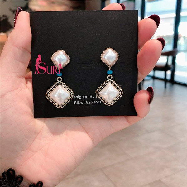 Bông Tai Tòn Teng 2 Hình Thoi Ánh Xà Cừ Trắng