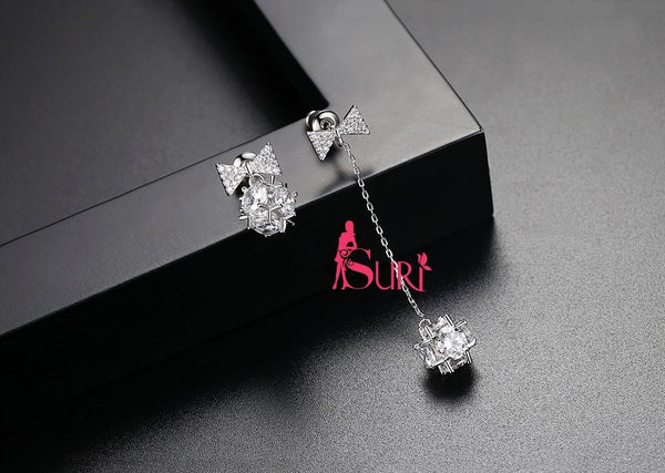 Bông Tai Bất Đối Xứng Tòn Teng Nơ Đá Đơn Giản