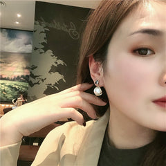 Bông Tai Tòn Teng Đá Tam Giác Ngọc Trai Trắng